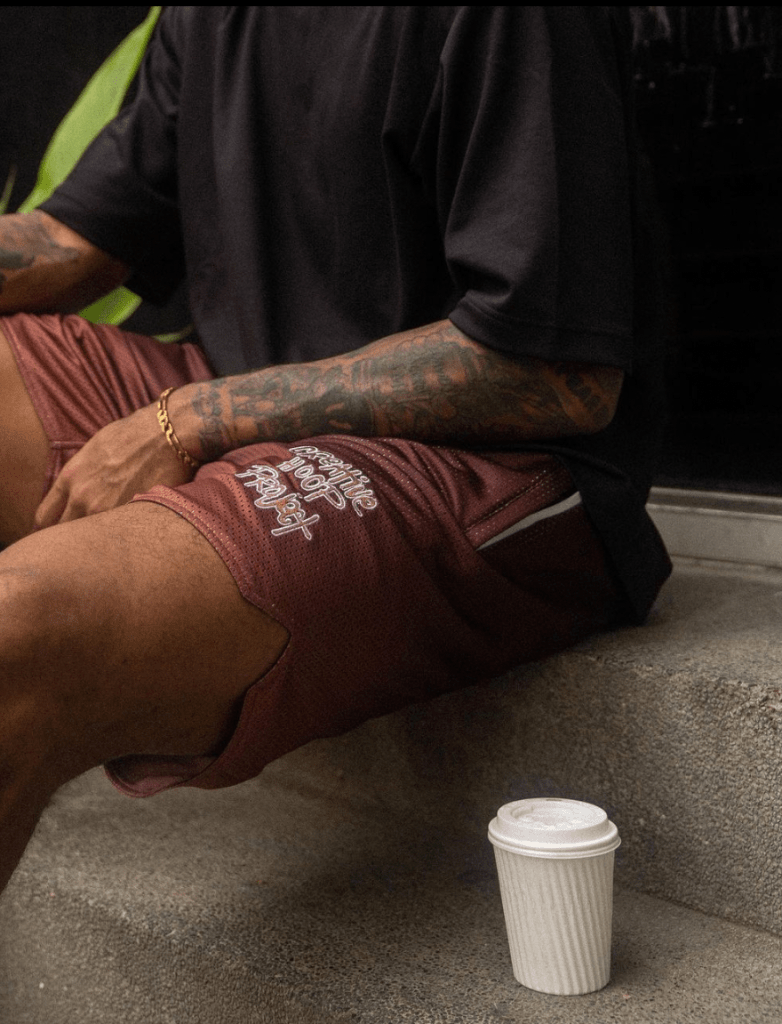 Man wearing Creative Hoop Project Coffee Shorts