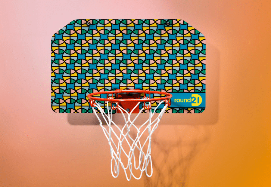 Colorful repeating basketball pattern on this Round21 mini basketball hoop